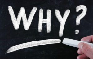 Chalk board with "Why?" written on it
