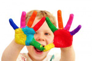 Photo of Happy child with painted hands