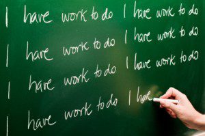 "Work to Do" writen repeatedly on green chalk board