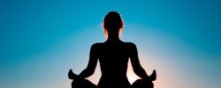 Silhouette image of woman meditating