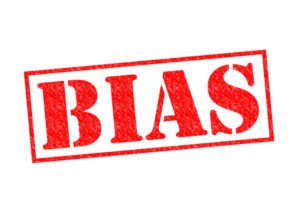 bias red rubber stamp over a white background.