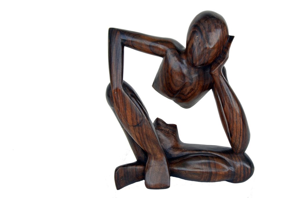 Photo of African wood carving of thinker - essential lifelong learning questions